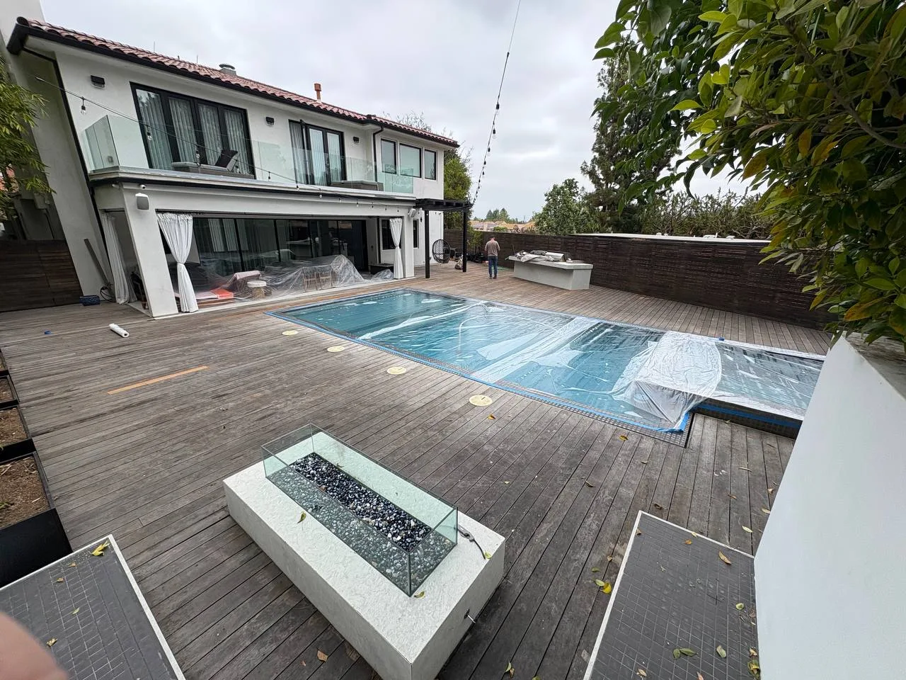 A cedar deck with railings built by an Academy student
