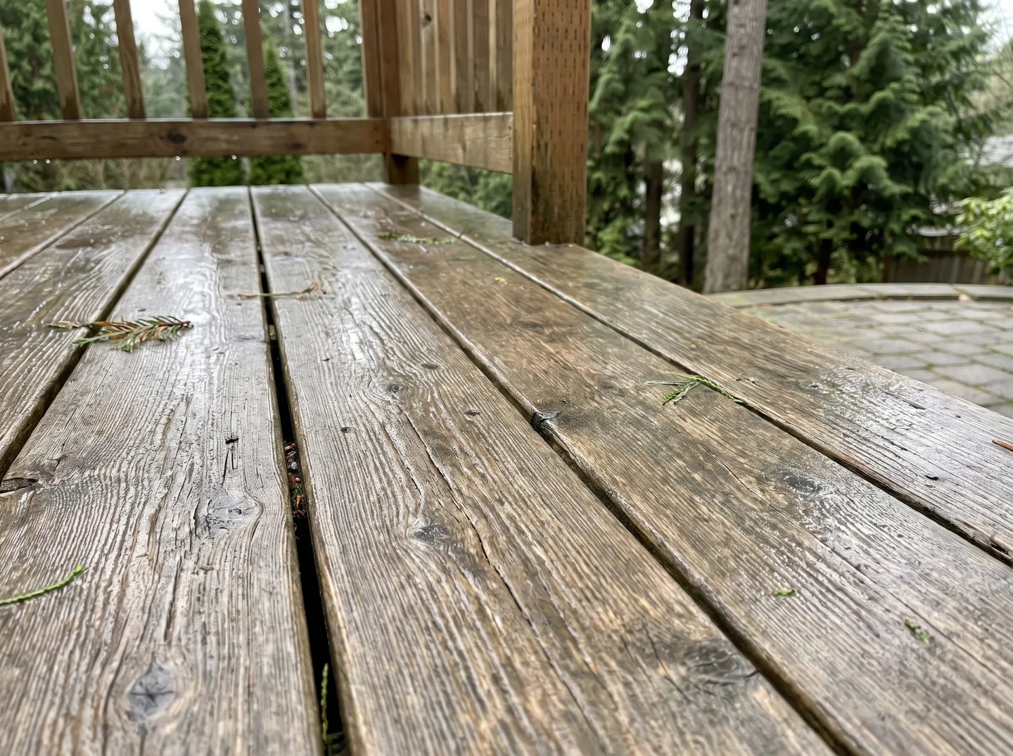 Well-kept ten-year-old cedar deck with graceful patina after rain