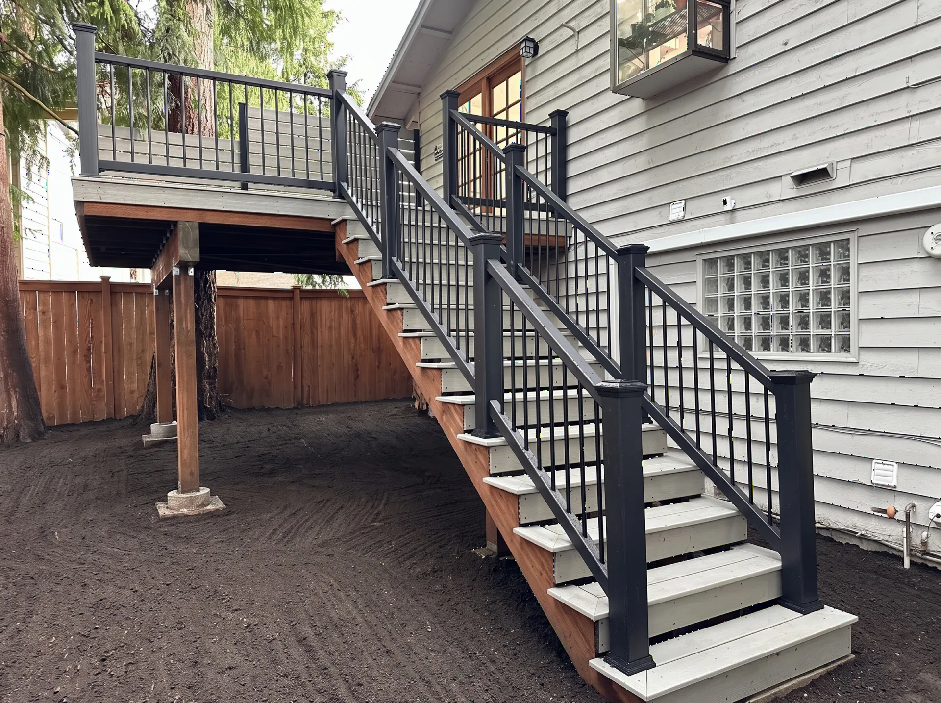 A small deck, rebuilt bigger — then a patio to match